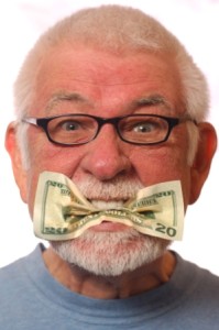 Man with money in mouth signifying expression