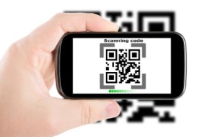 Smartphone in hand scanning code