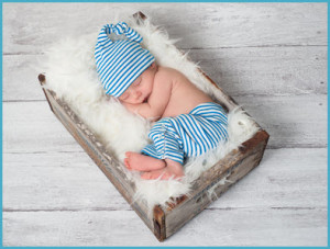 bigstock-Sleeping-Newborn-Baby-Wearing--43741447